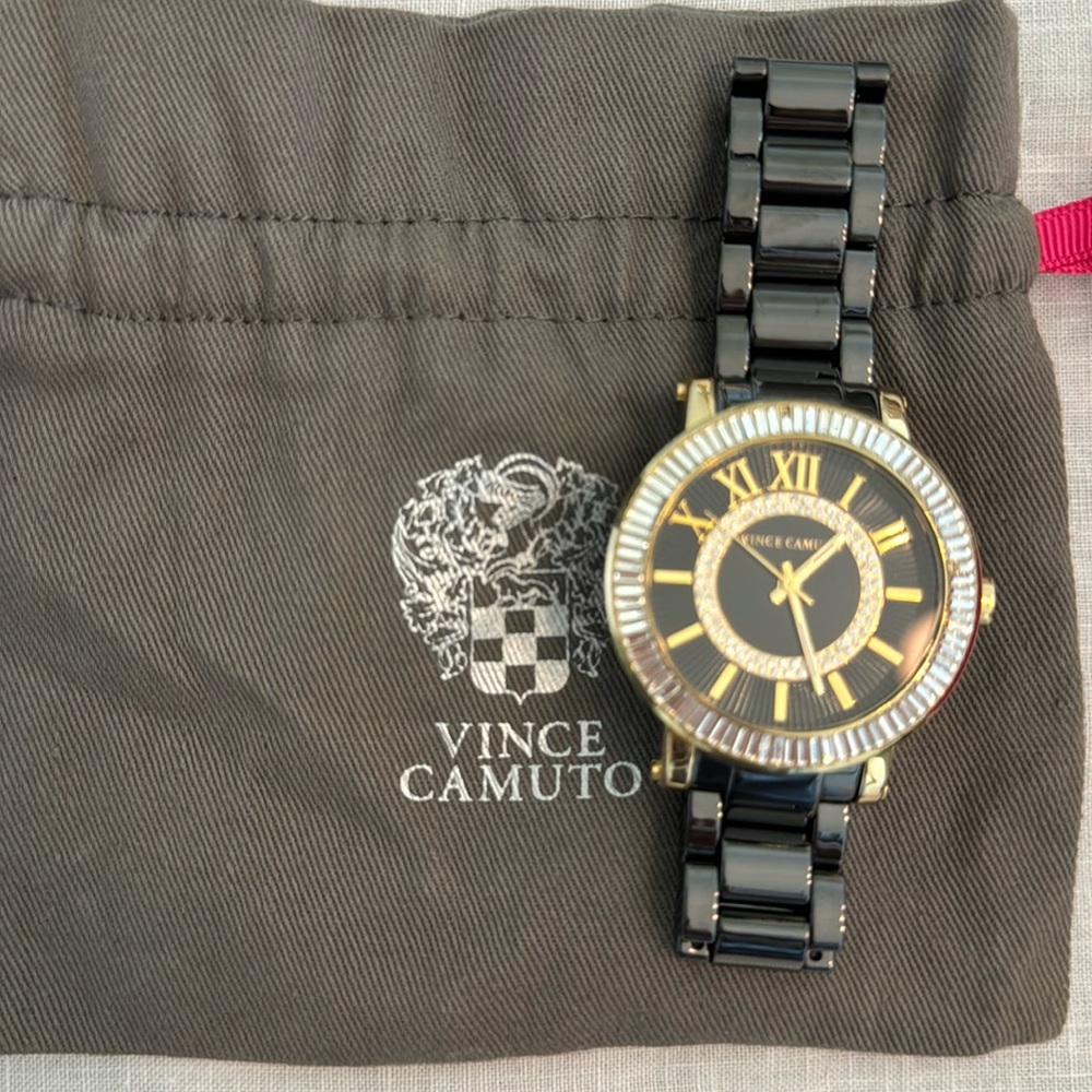 Vince Camuto Watch. Crystal baguette bezel and double round crystals on face.